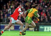 6 June 1999; John Duffy of Donegal in action against Mark McNeill of Armagh during the Bank of Ireland Ulster Senior Football Championship quarter-final match between Donegal and Armagh at MacCumhail Park in Ballybofey, Donegal. Photo by Ray Lohan/Sportsfile