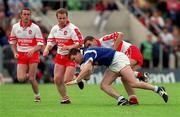 20 June 1999; Larry O'Reilly of Cavan in action against Sean Martin Lockhart, left, and Kieran McKeever of Derry during the Bank of Ireland Ulster Senior Football Championship quarter-final match between Cavan and Derry at Breffni Park in Cavan. Photo by Damien Eagers/Sportsfile