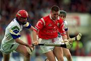 13 June 1999; Mark Landers of Cork in action against Fergal Hartley, left, and Billy O'Sullivan of Waterford during the Guinness Munster Senior Hurling Championship semi-final match between Cork and Waterford at Semple Stadium in Thurles, Tipperary. Photo by Ray McManus/Sportsfile