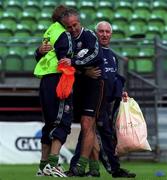 7 June 1999; Manager Mick McCarthy embraces Jason McAteer, left, as physiotherapist Mick Byrne looks on during a Republic of Ireland training session at Lansdowne Road in Dublin. Photo by David Maher/Sportsfile