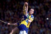 6 June 1999; Ollie Baker of Clare in action against David Kennedy of Tipperary during the Guinness Munster Senior Hurling Championship semi-final match between Clare and Tipperary at Páirc Uí Chaoimh in Cork. Photo by Ray McManus/Sportsfile