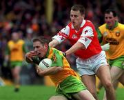 6 June 1999; Noel McGinley of Donegal in action against Paddy McKeever of Armagh during the Bank of Ireland Ulster Senior Football Championship quarter-final match between Donegal and Armagh at MacCumhail Park in Ballybofey, Donegal. Photo by Ray Lohan/Sportsfile