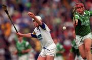 30 May 1999; TJ Ryan of Limerick in action against Fergal Hartley of Waterford during the Guinness Munster Senior Hurling Championship quarter-final match between Limerick and Waterford at Páirc Uí Chaoimh in Cork. Photo by Ray McManus/Sportsfile