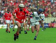 13 June 1999; Timmy McCarthy of Cork in action against Brian Greene of Waterford during the Guinness Munster Senior Hurling Championship semi-final match between Cork and Waterford at Semple Stadium in Thurles, Tipperary. Photo by Ray McManus/Sportsfile