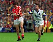 13 June 1999; Neil Ronan of Cork in action against Tom Feeney of Waterford during the Guinness Munster Senior Hurling Championship semi-final match between Cork and Waterford at Semple Stadium in Thurles, Tipperary. Photo by Ray McManus/Sportsfile