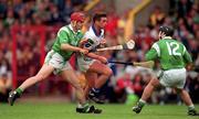 30 May 1999; Tony Browne of Waterford in action against TJ Ryan, left, and Barry Foley of Limerick during the Guinness Munster Senior Hurling Championship quarter-final match between Limerick and Waterford at Páirc Uí Chaoimh in Cork. Photo by Ray McManus/Sportsfile