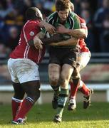 18 February 2006; Chris Keane, Connacht, is tackled by Martyn Madden, left and Gavin Thomas, Llanelli Scarlets. Celtic League 2005-2006, Connacht v Llanelli Scarlets, Sportsground, Galway. Picture credit: Damien Eagers / SPORTSFILE
