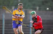 19 February 2006; Tony Griffin, Clare, in action against Paddy Hughes, Down. Allianz National Hurling League, Division 1A, Round 1, Clare v Down, Cusack Park, Ennis, Co. Clare. Picture credit: Kieran Clancy / SPORTSFILE