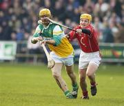 19 February 2006; Ger Oakley, Offaly, in action against Joe Deane, Cork. Allianz National Hurling League, Division 1A, Round 1, Offaly v Cork, St. Brendan's Park, Birr, Co. Offaly. Picture credit: Pat Murphy / SPORTSFILE