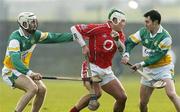 19 February 2006; Niall McCarthy, Cork, in action against Kevin Brady, left, and David Franks, Offaly. Allianz National Hurling League, Division 1A, Round 1, Offaly v Cork, St. Brendan's Park, Birr, Co. Offaly. Picture credit: Pat Murphy / SPORTSFILE