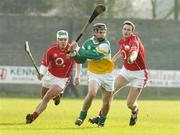 19 February 2006; Brendan Murphy, Offaly, in action against Niall McCartghy, left, and Graham Callanan, Cork. Allianz National Hurling League, Division 1A, Round 1, Offaly v Cork, St. Brendan's Park, Birr, Co. Offaly. Picture credit: Pat Murphy / SPORTSFILE