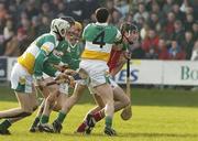 19 February 2006; Kieran Murphy, Cork, in action against,  from left, Kevin Brady, Paul Cleary, Ger Oakley, and David Franks, 4, Offaly. Allianz National Hurling League, Division 1A, Round 1, Offaly v Cork, St. Brendan's Park, Birr, Co. Offaly. Picture credit: Pat Murphy / SPORTSFILE