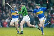 19 February 2006; Donal O'Grady, Limerick, solos away from Eoin Brislane, Tipperary. Allianz National Hurling League, Division 1B, Round 1, Limerick v Tipperary, Gaelic Grounds, Limerick. Picture credit: Brendan Moran / SPORTSFILE