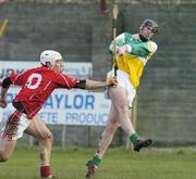 19 February 2006; Paul Cleary, Offaly, in action against Timmy McCarthy, Cork. Allianz National Hurling League, Division 1A, Round 1, Offaly v Cork, St. Brendan's Park, Birr, Co. Offaly. Picture credit: Pat Murphy / SPORTSFILE