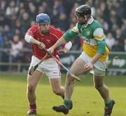 19 February 2006; Paul Cleary, Offaly, in action against Kieran Murphy. Allianz National Hurling League, Division 1A, Round 1, Offaly v Cork, St. Brendan's Park, Birr, Co. Offaly. Picture credit: Pat Murphy / SPORTSFILE