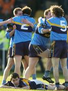 19 February 2006; Salthill Knocknacarra players celebrate as Kilmacud Crokes Brian McGrath looks on. Semi-Final, Salthill Knocknacarra v Kilmacud Crokes, Pearse Park, Longford. Picture credit: Damien Eagers / SPORTSFILE