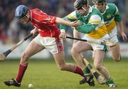 19 February 2006; Ronan Conway, Cork, in action against Brendan O'Meara, left, and Paul Cleary, Offaly. Allianz National Hurling League, Division 1A, Round 1, Offaly v Cork, St. Brendan's Park, Birr, Co. Offaly. Picture credit: Pat Murphy / SPORTSFILE