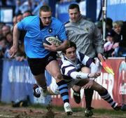 20 February 2006; Patrick Brophy, St Michael's, evades a tackle by Kevin Mahoney, Clongowes Wood College, en route to scoring his sides first try. Leinster Schools Senior Cup, St Michael's v Clongowes Wood College, Donnybrook, Dublin. Picture credit: Ciara Lyster / SPORTSFILE