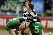 21 February 2006; Eoin O'Malley, Belvedere College, is tackled by Gavin Fitzgerald, (6) and Dan O'Sullivan, Gonzaga College. Leinster Schools Senior Cup, 2nd Round, Gonzaga College v Belvedere College, Donnybrook, Dublin. Picture credit: Damien Eagers / SPORTSFILE