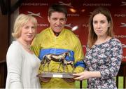 1 May 2014; Ann Murray, wife of Colm Murray, and his daughter Kate present winning jockey Barry Geraghty with his trophy after the Colm Murray Memorial Handicap Hurdle. Punchestown Racecourse, Punchestown, Co. Kildare. Picture credit: Matt Browne / SPORTSFILE