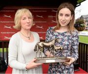 1 May 2014; Ann Murray, wife of Colm Murray, and his daughter Kate with the Colm Murray Memorial Handicap Hurdle trophy. Punchestown Racecourse, Punchestown, Co. Kildare. Picture credit: Matt Browne / SPORTSFILE
