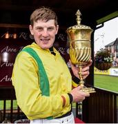 1 May 2014; Ger Fox celebrates with the La Touche Cup after winning Avon Ri Corporate & Leisure Resort Steeplechase aboard Jacks Island. Punchestown Racecourse, Punchestown, Co. Kildare. Picture credit: Matt Browne / SPORTSFILE