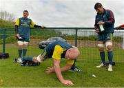 1 May 2014; Munster's Paul O'Connell stretches, alongside team-mates James Coughlan, left, and Donncha O'Callaghan, before squad training ahead of their side's Celtic League 2013/14, Round 21, match against Edinburgh on Saturday. Munster Rugby Squad Training, Cork Institute of Technology, Bishopstown, Cork. Picture credit: Diarmuid Greene / SPORTSFILE