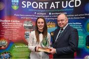 1 May 2014; Rebecca Evans of the Ladies Hockey Club is presented with the Elite Team of the Year award by Professor Andrew Deeks, President of UCD, during the UCD Sports Awards 2013/2014. Astra Hall, UCD, Belfield, Dublin. Picture credit: Stephen McCarthy / SPORTSFILE