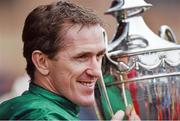2 May 2014; Jockey Tony McCoy lifts the trophy after he rode Jezki to win the Racing Post Champion Hurdle. Punchestown Racecourse, Punchestown, Co. Kildare. Picture credit: Barry Cregg / SPORTSFILE