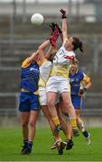 3 May 2014; Emma Kelly outjumps her Antrim team-mate Aine Tubridy and Roscommon's Laura Fleming to punch the ball clear. TESCO Ladies National Football League Division 4 Final, Antrim v Roscommon, O'Connor Park, Tullamore, Co. Offaly. Picture credit: Ray McManus / SPORTSFILE