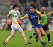 3 May 2014; Kirsty McGuinness, Antrim, in action against Ruth Finlass, Roscommon. TESCO Ladies National Football League Division 4 Final, Antrim v Roscommon, O'Connor Park, Tullamore, Co. Offaly. Picture credit: Ray McManus / SPORTSFILE