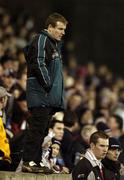 25 February 2006; QUB manager James McCartan stands on a wall next to the pitch after he was send off by referee Mick Monaghan. Datapac Sigerson Cup Final, Queens University, Belfast v Dublin City University, Parnell Park, Dublin. Picture credit: Damien Eagers / SPORTSFILE