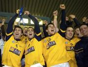 25 February 2006; DCU players Bryan Cullen and Paul Casey lift the cup. Datapac Sigerson Cup Final, Queens University, Belfast v Dublin City University, Parnell Park, Dublin. Picture credit: Damien Eagers / SPORTSFILE