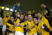 25 February 2006; DCU captain Bryan Cullen lifts the cup surrounded by team-mates. Datapac Sigerson Cup Final, Queens University, Belfast v Dublin City University, Parnell Park, Dublin. Picture credit: Damien Eagers / SPORTSFILE