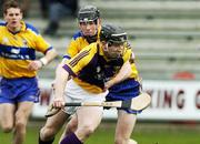 26 February 2006; Michael Jordan, Wexford, is tackled by Patrick Donnellan, Clare. Allianz National Hurling League, Division 1A, Round 2, Wexford v Clare, Wexford Park, Wexford. Picture credit: Matt Browne / SPORTSFILE