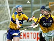 26 February 2006; Tommy Holland, Clare, in action against MJ Furlong, Wexford. Allianz National Hurling League, Division 1A, Round 2, Wexford v Clare, Wexford Park, Wexford. Picture credit: Matt Browne / SPORTSFILE