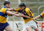 26 February 2006; MJ Furlong, Wexford, is tackled by Colm Forde, Clare. Allianz National Hurling League, Division 1A, Round 2, Wexford v Clare, Wexford Park, Wexford. Picture credit: Matt Browne / SPORTSFILE