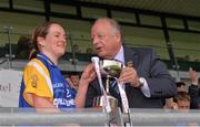 3 May 2014; The Roscommon captain Feena Beirne is presented with the cup by Pat Quill, President of the Ladies Gaelic Football Association. TESCO Ladies National Football League Division 4 Final, Antrim v Roscommon, O'Connor Park, Tullamore, Co. Offaly. Picture credit: Ray McManus / SPORTSFILE
