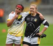 3 May 2014; Antrim players Shannon Graham and goalkeeper Eleanor Mallon consider what might have been during the cup presentation. TESCO Ladies National Football League Division 4 Final, Antrim v Roscommon, O'Connor Park, Tullamore, Co. Offaly. Picture credit: Ray McManus / SPORTSFILE