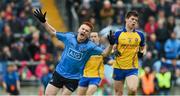 3 May 2014; Conor McHugh, Dublin, celebrates after shooting past Roscommon's Mark Healy, right, and scoring the Dublin goal early in the second half. Cadbury GAA Football All-Ireland U21 Championship Final, Dublin v Roscommon, O'Connor Park, Tullamore, Co. Offaly. Picture credit: Ray McManus / SPORTSFILE