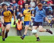 3 May 2014; Conor McHugh, Dublin, shoots past Roscommon's Mark Healy to score the Dublin goal early in the second half. Cadbury GAA Football All-Ireland U21 Championship Final, Dublin v Roscommon, O'Connor Park, Tullamore, Co. Offaly. Picture credit: Ray McManus / SPORTSFILE