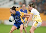 3 May 2014; Sinéad Kenny, Roscommon, in action against Nicole Kelly, Antrim. TESCO Ladies National Football League Division 4 Final, Antrim v Roscommon, O'Connor Park, Tullamore, Co. Offaly. Picture credit: Dáire Brennan / SPORTSFILE