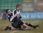28 February 2006; Conor Murphy, Cistercian College, Roscrea, is tackled by Jonathan Grey, Newbridge College. Leinster Schools Junior Cup, Quarter-Final, Newbridge College v Cistercian College, Roscrea, Donnybrook, Dublin. Picture credit; David Levingstone / SPORTSFILE