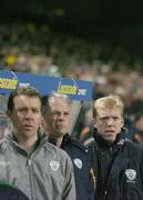 1 March 2006; Republic of Ireland manager Steve Staunton stands along assistant manager Kevin McDonald, centre, and goalkeeping coach Alan Kelly, left, during the national anthems before the game. International Friendly, Republic of Ireland v Sweden, Lansdowne Road, Dublin. Picture credit: Brendan Moran / SPORTSFILE
