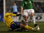 1 March 2006; The pitch gets torn up as Zlatan Ibrahimovic, Sweden, tackles Ian Harte, Republic of Ireland. International Friendly, Republic of Ireland v Sweden, Lansdowne Road, Dublin. Picture credit: David Maher / SPORTSFILE