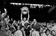 26 September 1976; The Dublin captain Tony Hanahoe lifts the Sam Maguire Cup alongside Uachtarán Chumann Lúthchleas Gael Con Murphy followingt the All-Ireland Football Final match between Dublin and Kerry at Croke Park in Dublin. Photo by Connolly Collection/Sportsfile