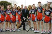 28 February 2006; Irish cycling received a major boost with the launch of the first-ever domestic professional cycling team - Team Murphy and Gunn/Newlyn Group - at the Murphy & Gunn showrooms in Milltown, Dublin. Pictured at the launch with Manchester United manager Sir Alex Ferguson are members of the team and models Roberta Rowat and Aoife Cogan. Murphy & Gunn Garage, Milltown, Dublin. Picture credit: Brendan Moran / SPORTSFILE
