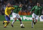 1 March 2006; Steven Reid, Republic of Ireland, supported by team-mate John O'Shea, right, holds off the challenge of Tobias Linderoth, Sweden. International Friendly, Republic of Ireland v Sweden, Lansdowne Road, Dublin. Picture credit: Pat Murphy / SPORTSFILE