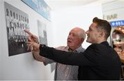 8 May 2014; Goalkeeper with the All-Ireland Football winning Dublin team of 1974 Paddy Cullen and current Dublin footballer Paul Flynn examine the 1974 team picture at a 40th anniversary reception hosted by the Dublin Airport Authority. Dublin Airport, Dublin. Picture credit: Stephen McCarthy / SPORTSFILE