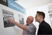8 May 2014; Goalkeeper with the All-Ireland Football winning Dublin team of 1974 Paddy Cullen and current Dublin footballer Paul Flynn examine the 1974 team picture at a 40th anniversary reception hosted by the Dublin Airport Authority. Dublin Airport, Dublin. Picture credit: Stephen McCarthy / SPORTSFILE